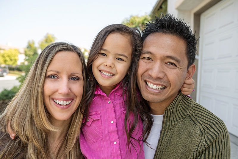 family of three taking a selfie