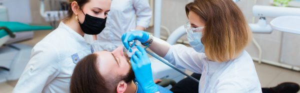 man getting a dental cleaning