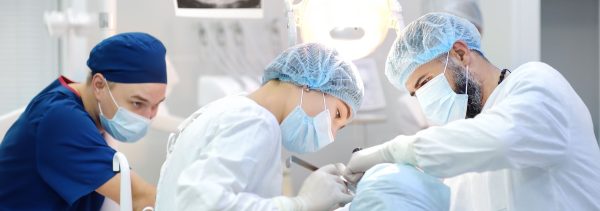Dentists operating on a patient